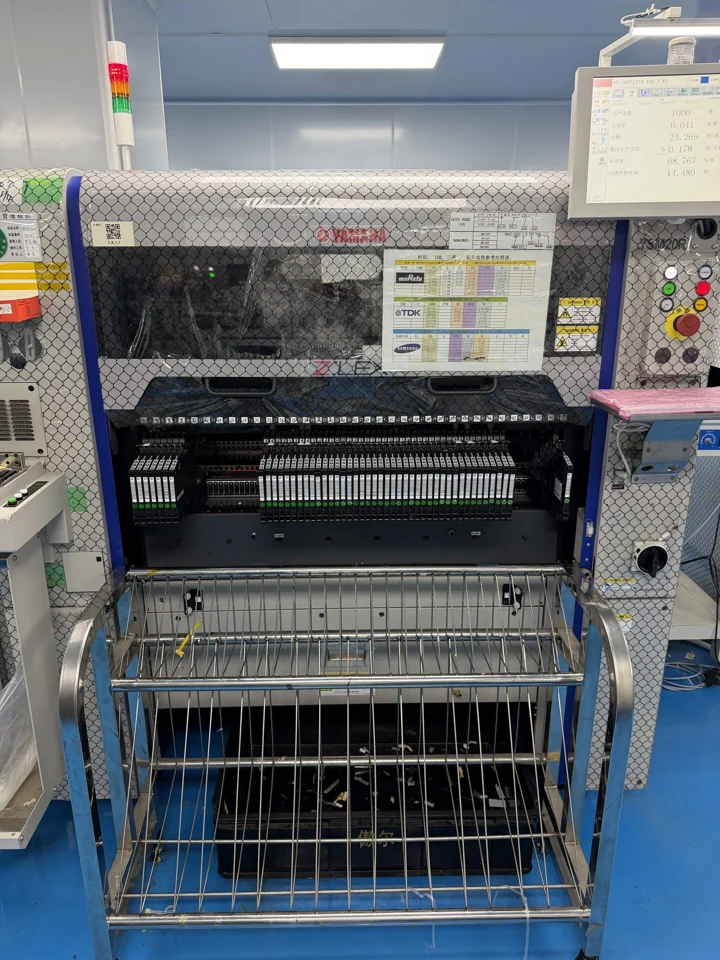 Placement machine with rows of feeders and a reel rack — Shenzhen PCBA factory