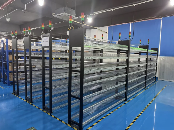 Rows of reel-storage racks with indicator lights — Shenzhen PCBA factory