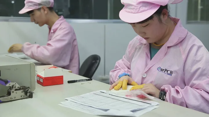 Material preparation: paperwork and parts are reviewed at the bench. Shijiazhuang PCBA factory